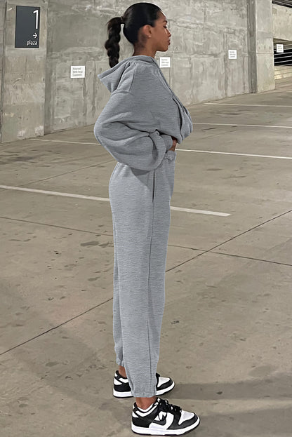 Conjunto deportivo de sudadera con capucha de hombros caídos y joggers, color gris liso