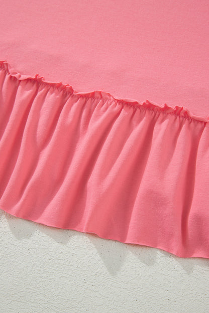 Camiseta talla grande color melocotón sólido con costura sin rematar y bajo con volantes