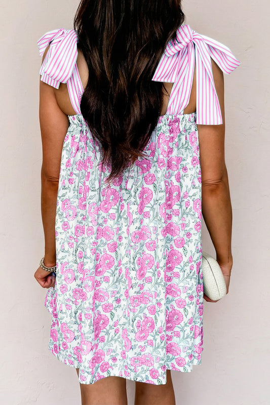 Minivestido con tirantes de lazo, retazos a rayas y estampado floral rosa