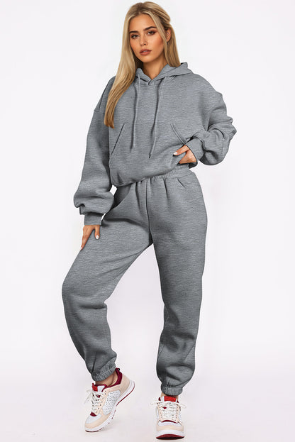 Conjunto deportivo de sudadera con capucha de hombros caídos y joggers, color gris liso