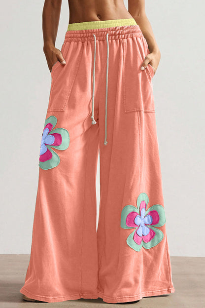 Pantalón de pierna ancha con cordón y cintura elástica contrastada, estampado floral en bloques de color naranja y pomelo