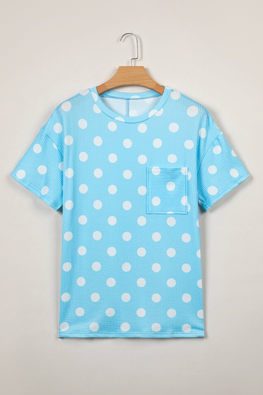 Blusa de jacquard con cuello redondo, hombros caídos, bolsillo de parche y lunares celestes