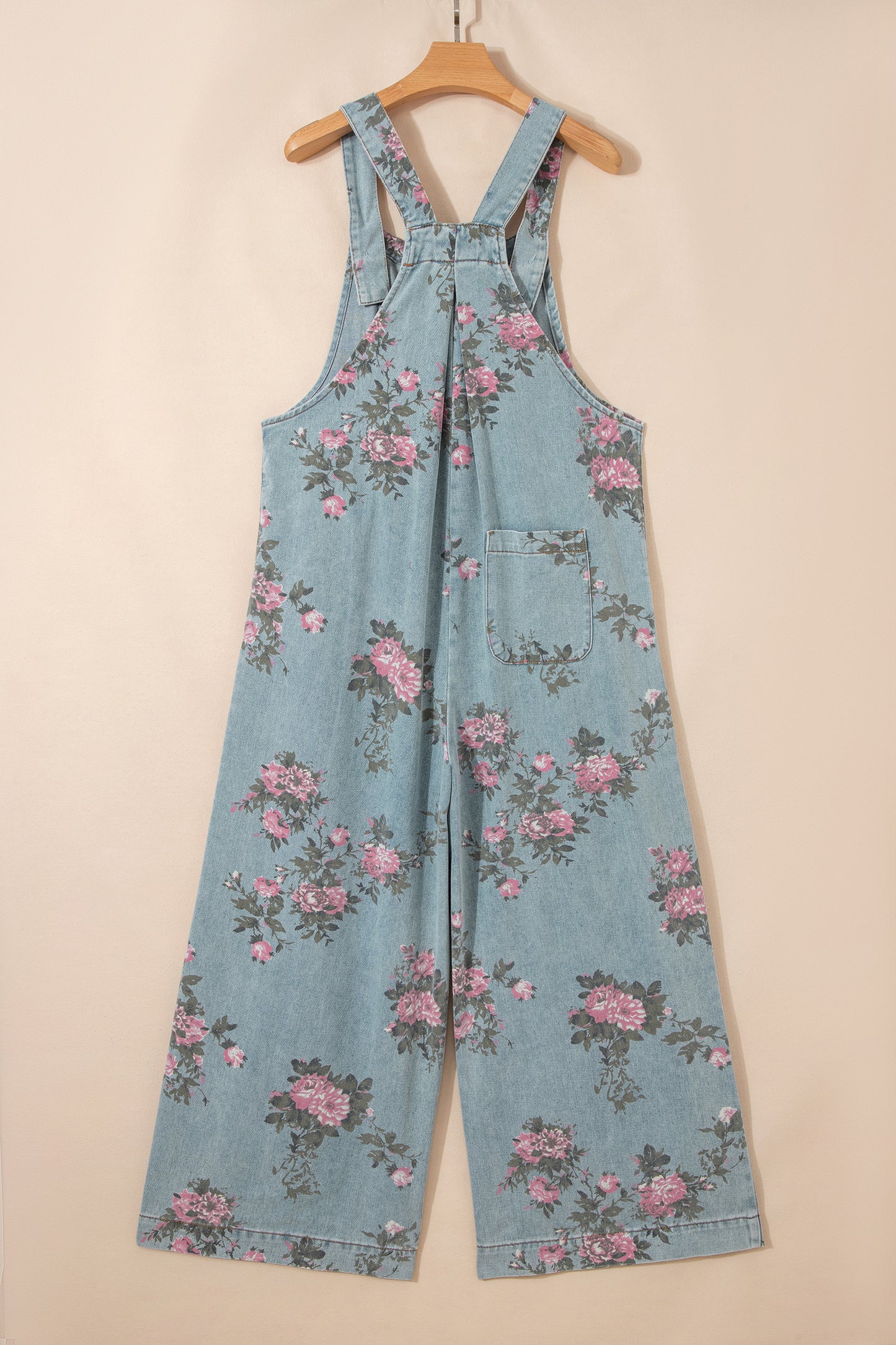 Mono vaquero Beau azul con estampado floral, pliegues, talle alto y pierna ancha