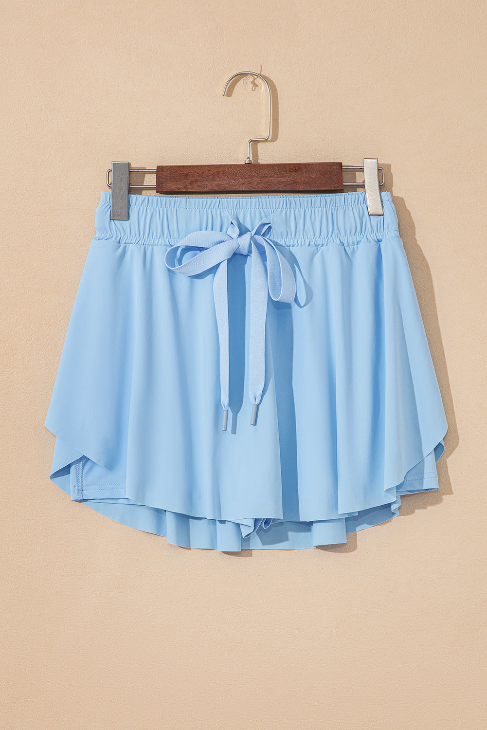Faldas pantalón de tenis forradas, azul cielo, con cintura elástica con cordón