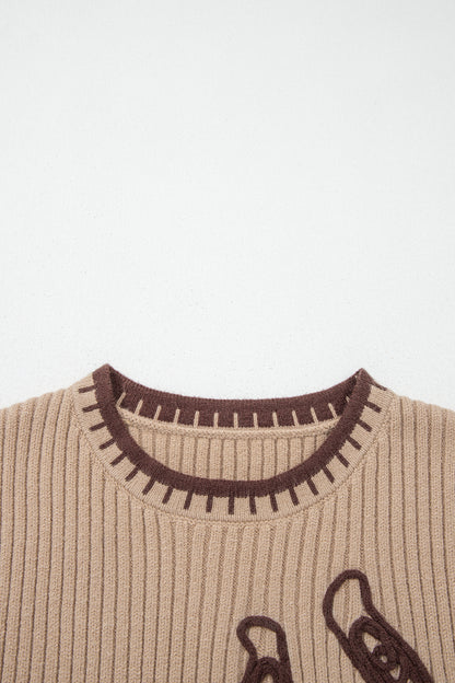 Chaleco de punto acanalado beige francés claro con cuello redondo y ribetes en contraste.
