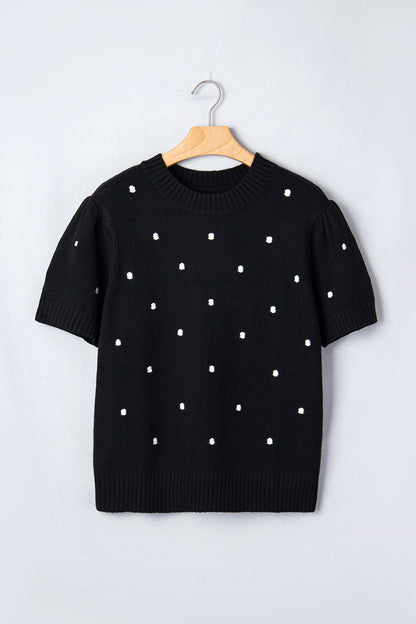 Suéter negro elegante de burbujas con lunares y manga corta