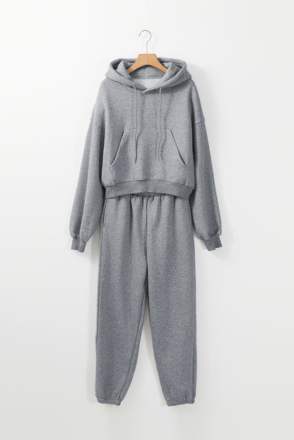 Conjunto deportivo de sudadera con capucha de hombros caídos y joggers, color gris liso