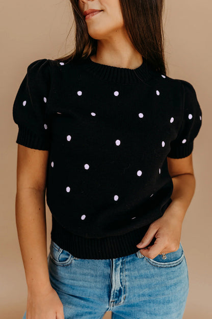 Suéter negro elegante de burbujas con lunares y manga corta