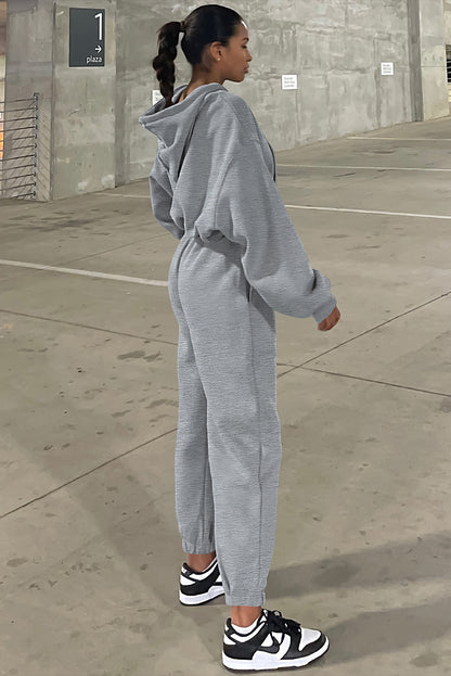Conjunto deportivo de sudadera con capucha de hombros caídos y joggers, color gris liso