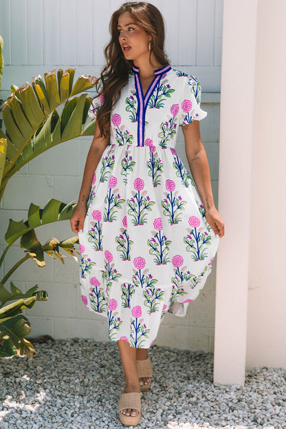 Vestido maxi blanco floral con mangas abullonadas cortas, escote en V y cintura alta