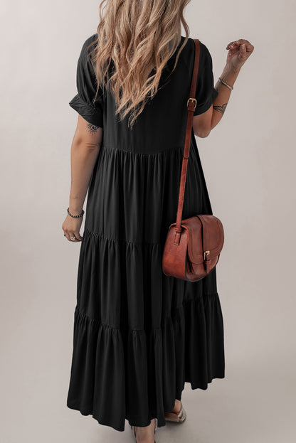 Vestido largo acampanado con volantes escalonados, manga corta y botones ocultos negros