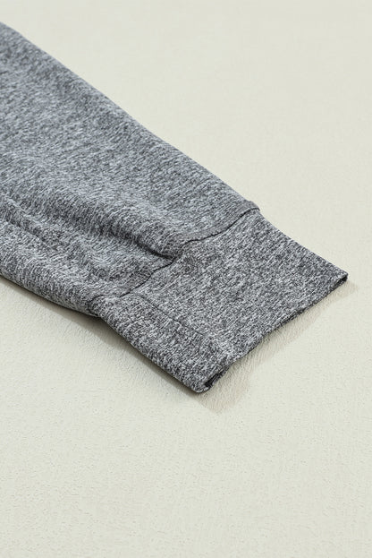 Pantalones deportivos grises con cordón, cintura elástica y bolsillos
