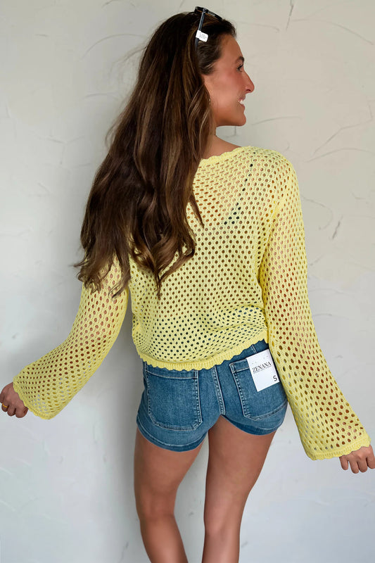 Blusa de punto calada de manga larga amarilla con ribete festoneado