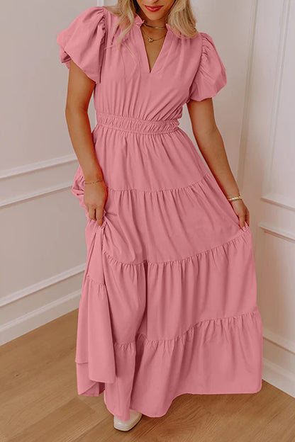 Vestido largo maxi rosa pálido de color liso, escote en V, manga corta abullonada y cintura alta con volantes.