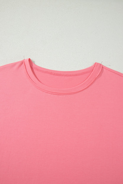 Camiseta talla grande color melocotón sólido con costura sin rematar y bajo con volantes