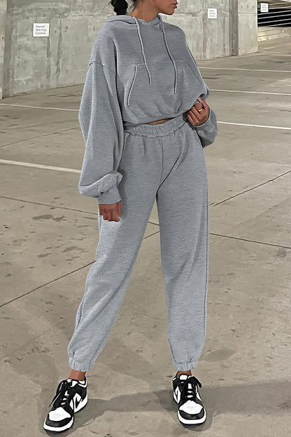 Conjunto deportivo de sudadera con capucha de hombros caídos y joggers, color gris liso