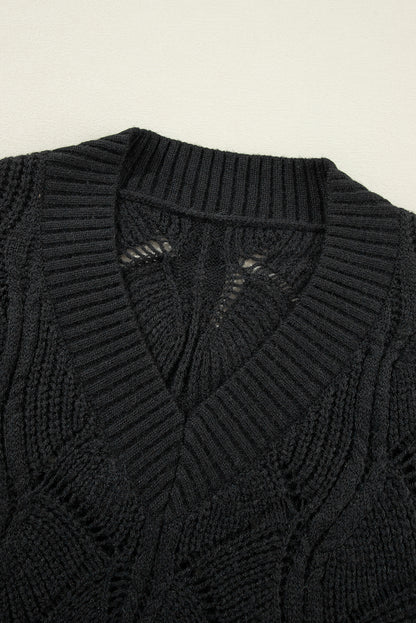 Suéter de punto calado negro con cuello de pico y hombros caídos