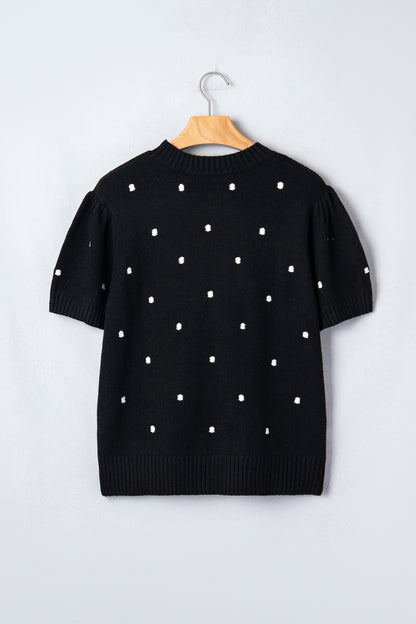 Suéter negro elegante de burbujas con lunares y manga corta