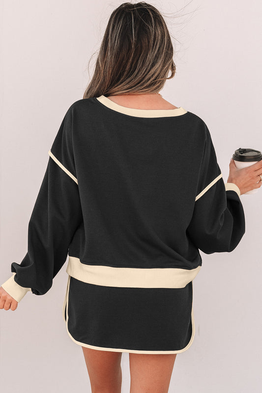 Conjunto de falda pantalón con contraste de color negro y jerséi holgado con cordones en la cintura