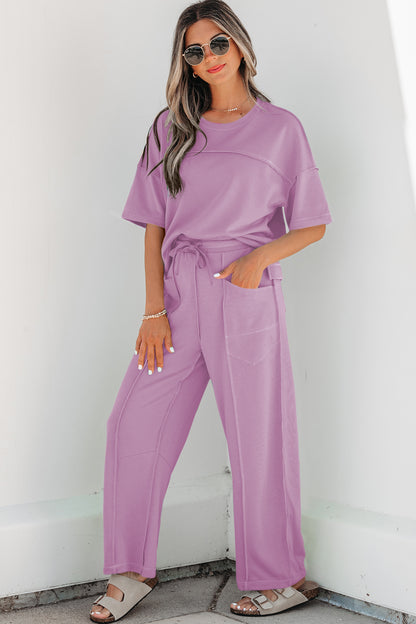 Conjunto de camiseta holgada de hombros caídos y pantalones tipo barril con estampado de orquídeas